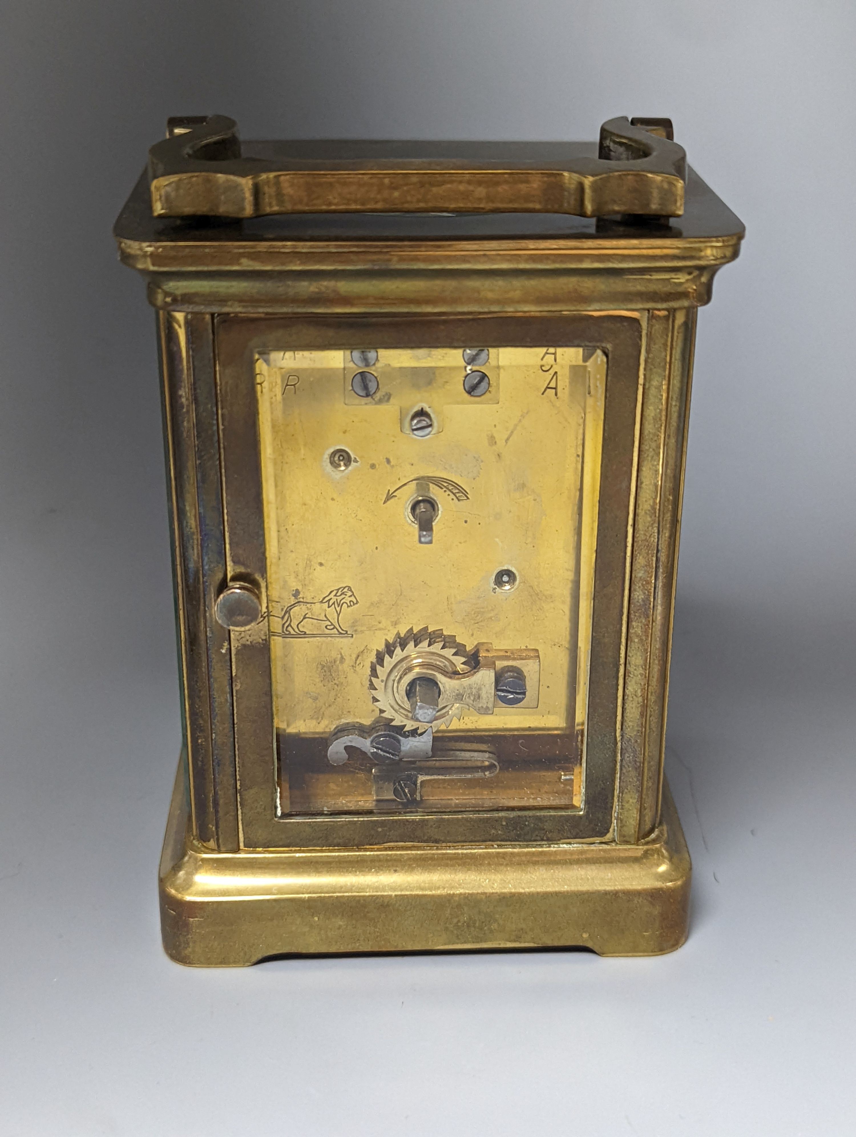A French brass carriage timepiece, 14cm. including handle